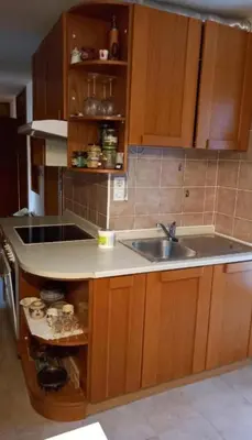 a kitchen with a sink and a counter top at Draga - 2 bedroom apartment in Tržič