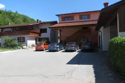 a group of cars parked in a parking lot at Apartments Masera in Kobarid