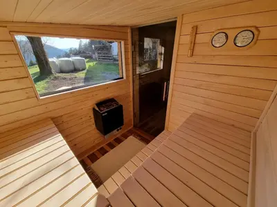 an overhead view of a sauna with a window and clocks at Apartma1 pri Adamu in Mislinja