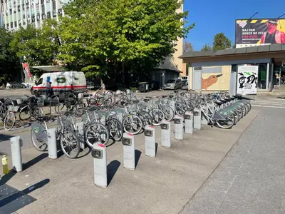 a bunch of bikes are lined up on a sidewalk at Sleep&Go Hostel Ljubljana in Ljubljana