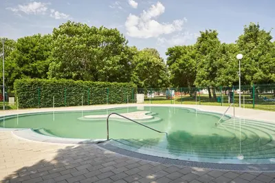 a small pool of water in a park at Thermal Resort Hotel Lendava in Lendava