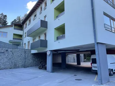 a parking lot in front of a building at Luxury 3-room large Apartment Maribor Pohorje in Pohorje