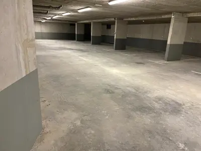 an empty parking lot in an empty parking garage at Luxury 3-room large Apartment Maribor Pohorje in Pohorje