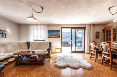 a living room with a couch and a table at Holiday Chalet near Bled in Obrne