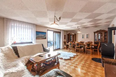 a living room with a couch and a table at Holiday Chalet near Bled in Obrne