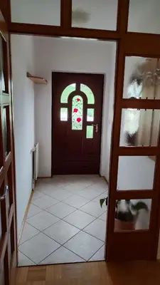 a room with a door and a tile floor at Apartma Alda in Preserje