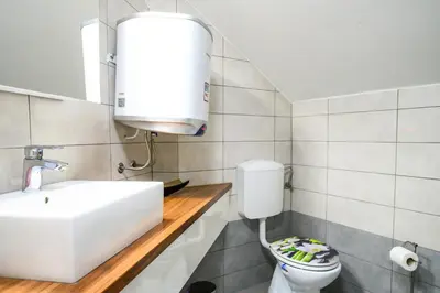 a bathroom with a sink and a toilet at The City Loft in Ljubljana