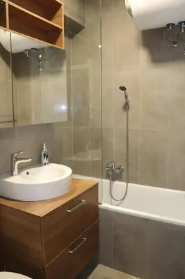 a bathroom with a sink and a shower and a tub at Studio apartma Terme Ptuj in Ptuj