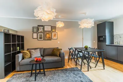 a living room with a couch and a table at Vila Valentina in Ljubljana