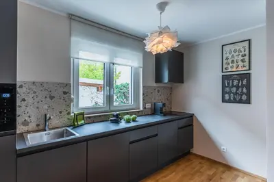 a kitchen with a sink and a window at Vila Valentina in Ljubljana