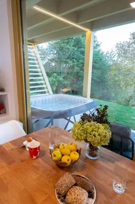 a table with a bowl of fruit on top of it at Holiday house Hona Lux in Velike Lašče