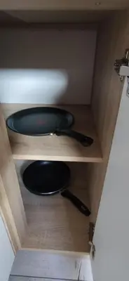 a wooden shelf with a black sink in a cabinet at Veronika's House je prijeten, miren apartma v naravi, blizu mesta in Celje