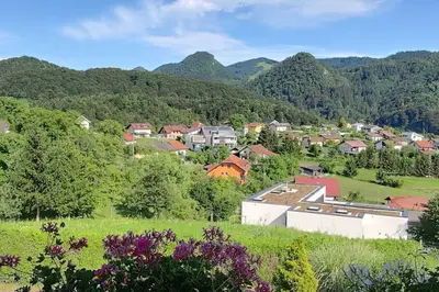 a small town in a valley with mountains at Veronika's House je prijeten, miren apartma v naravi, blizu mesta in Celje