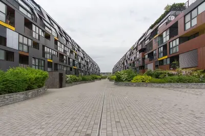 an empty sidewalk in front of some buildings at Gorgeous central flat with garage in Ljubljana