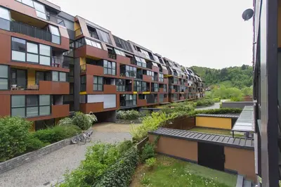 an apartment building with a courtyard with a garden at Gorgeous central flat with garage in Ljubljana