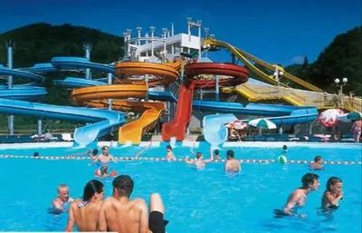 a group of people in the water at a water park at F95 AQUALUNA KAMP NATURA PODČETRTEK swimming card not included in Podčetrtek