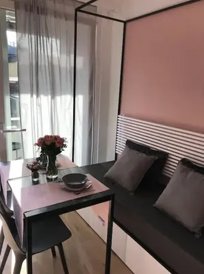 a room with a table and a couch and a table and a table sidx sidx at Sunny home with cute dragon in the center+parking in Ljubljana