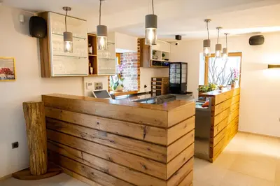 a kitchen with a wooden counter top in a room at Resort Village Majer - Apartments, Glamping - Slovenia in Gradac