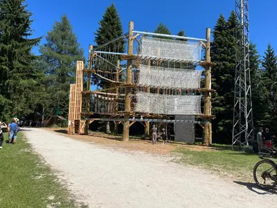 a large playground structure on a dirt road at Apartment & Studio Forest Paradise in Cerkno