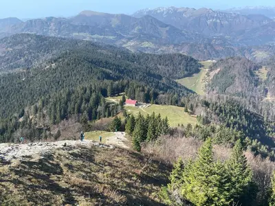 a person standing on top of a mountain at Apartment & Studio Forest Paradise in Cerkno