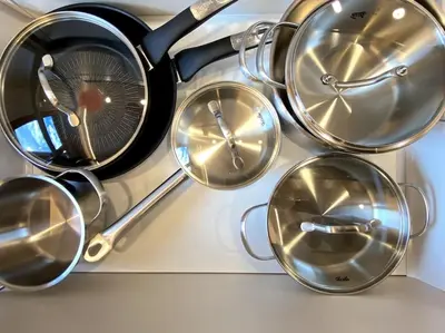 a bunch of metal straining utensils on a shelf at Lux Apartment Ski&Golf in Kranjska Gora