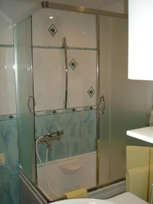 a shower with a glass door in a bathroom at Apartment Lake Bohinj no. 5 in Bohinj