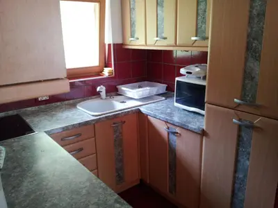 a small kitchen with a sink and a microwave at Apartment Lake Bohinj no. 5 in Bohinj