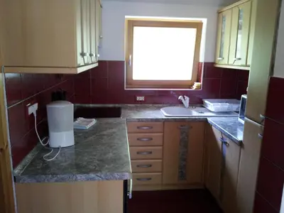 a small kitchen with a sink and a window at Apartment Lake Bohinj no. 5 in Bohinj