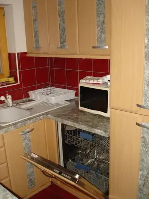 a kitchen with a sink and a microwave at Apartment Lake Bohinj no. 5 in Bohinj