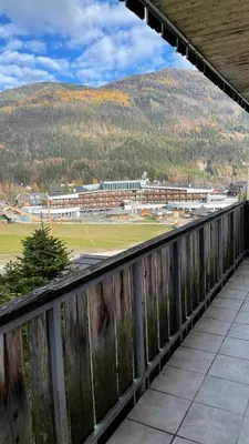 a view of a baseball field from a balcony at Apartment Katrca Kranjska Gora in Kranjska Gora