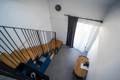 an overhead view of a room with a spiral staircase at Villa Magdalena apartments & rooms GARNI HOTEL in Maribor
