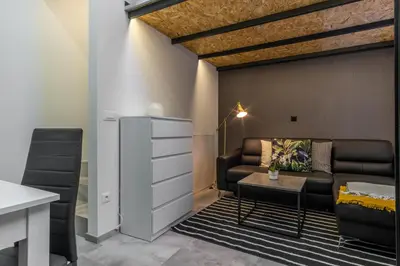 a living room with a couch and a table at Apartments Park Vodice - Ljubljana, Krvavec in Woditz