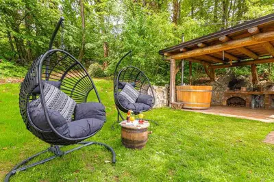 two chairs sitting in the grass in a yard at Holiday home in Novo Mesto - Dolenjska Bela krajina Unter- Weißkrain 35158 in Novo Mesto