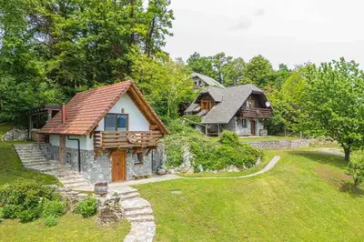 a home with a large yard with a house at Holiday home in Novo Mesto - Dolenjska Bela krajina Unter- Weißkrain 35158 in Novo Mesto