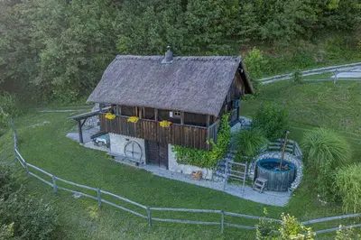 an aerial view of a small house with a yard at Holiday home in Otocec - Kranjska Krain 26039 in Otočec