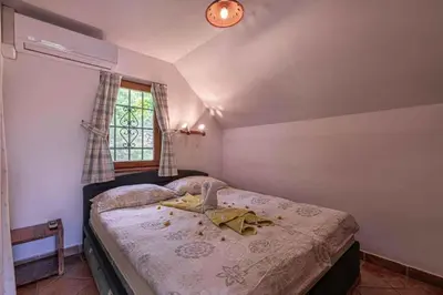 a bedroom with two beds and a window at Holiday home in Novo mesto - dostava - Kranjska Krain 26036 in Trška Gora