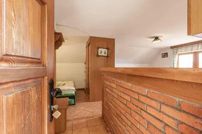 an open door to a room with a brick wall at Holiday home in Novo mesto - dostava - Kranjska Krain 26036 in Trška Gora