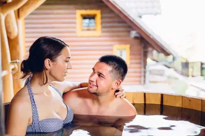 a man and a woman in a bath tub at Holiday home in Novo mesto - dostava - Kranjska Krain 26036 in Trška Gora