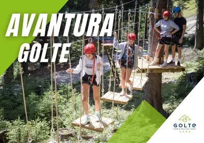 a group of people on a zip line in a forest at Golte Apartment Tibona in Mozirje