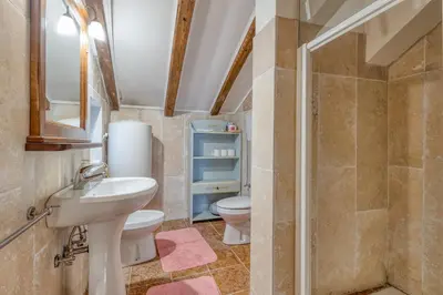 a bathroom with a sink and a toilet at Country House Viktor in Kranjska Gora