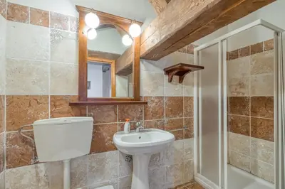 a bathroom with a toilet and a sink at Country House Viktor in Kranjska Gora