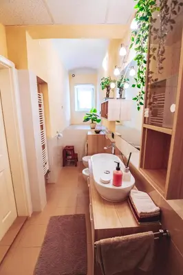 a bathroom with a sink and two toilets at Central Living Vegova-with parking in Ljubljana