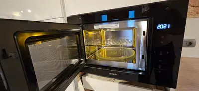 a microwave oven with a food inside of it at AppPrusnik in Ljubljana