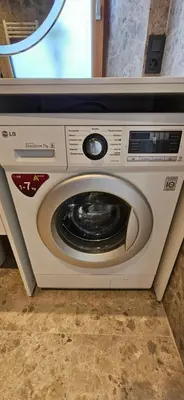 a washing machine with its door open in a room at AppPrusnik in Ljubljana