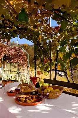 a table topped with plates of food and wine glasses at Studio in Novo mesto - dostava - Kranjska Krain 26035 in Mačkovec pod Trško Goro