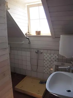 a bathroom with a shower and a sink and a window at Studio in Novo mesto - dostava - Kranjska Krain 26035 in Mačkovec pod Trško Goro