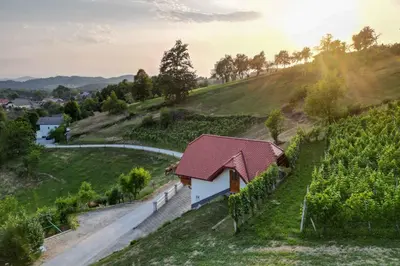 a small house on a hill next to a road at Holiday home in Trebelno - Dolenjska & Bela krajina Unter- & Weißkrain 26032 in Trebelno