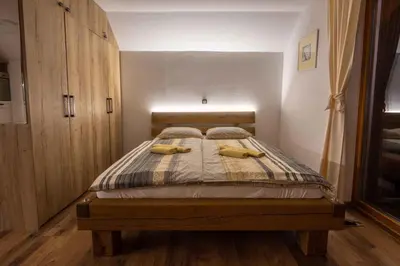 a bedroom with a bed with two yellow pillows on it at Holiday home in Trebelno - Dolenjska & Bela krajina Unter- & Weißkrain 26032 in Trebelno