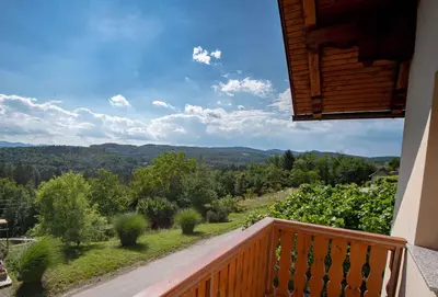 a balcony of a house with a view of the mountains at Holiday home in Dobrnic - Dolenjska & Bela krajina Unter- & Weißkrain 26093 in Dobrnič