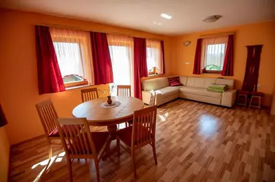 a living room with a table and chairs and a couch at Holiday home in Dobrnic - Dolenjska & Bela krajina Unter- & Weißkrain 26093 in Dobrnič